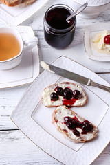 Fresh bread with cherry jam and homemade butter