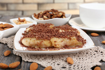 Sweetened fried banana on plate, close-up