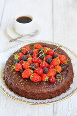 Chocolate cake with berries, selective focus