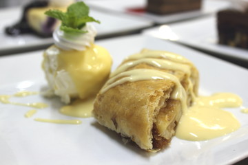 Apple Strudel with hot vanilla sauce