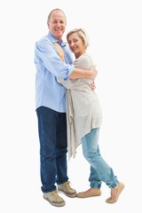 Happy mature couple hugging and smiling