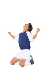 Football player in blue celebrating