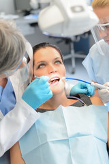 Naklejka na ściany i meble Dental team checkup woman patient teeth