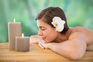 Obraz na płótnie Canvas Beautiful young woman on massage table