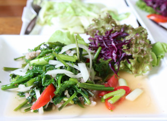 Fried mix vegetables on white plate.