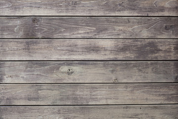 background consisting of weathered grey boards