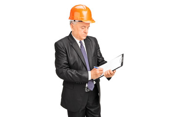 Construction worker taking notes on a clipboard