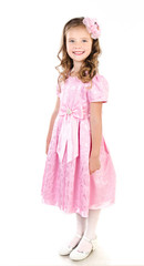 Adorable smiling little girl in pink princess dress isolated