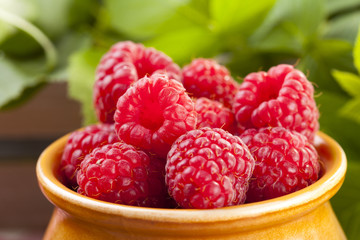 Jug with raspberries