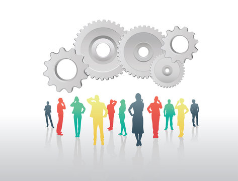 Business people standing under cogs and wheels