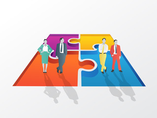 Business people standing on jigsaw piece