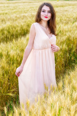 beautiful woman posing in wheat field