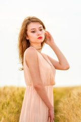 beautiful woman posing in wheat field