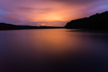 Fototapeta na wymiar red light reflex on a lake in a spectacular sunset
