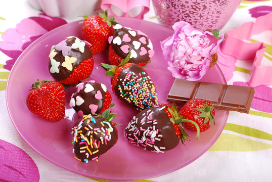 chocolate covered fresh strawberries  with colorful sprinkles
