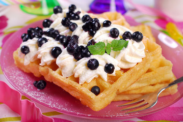 waffles with whipped cream and blueberries