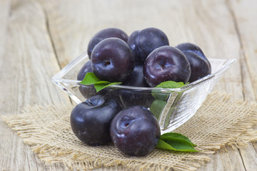 fresh plums in a bowl