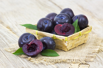 fresh plums in a basket