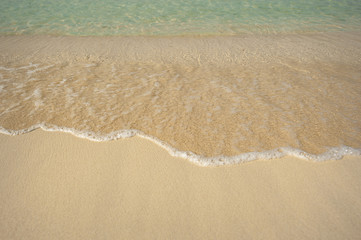 clear water and sand on the seashore