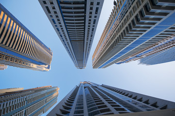 Fototapeta na wymiar office skyscrapers on blue sky background