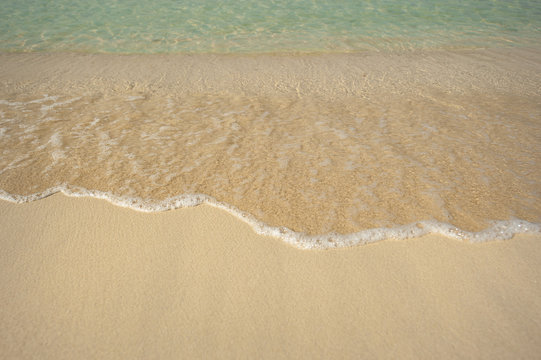 clear water and sand on the seashore