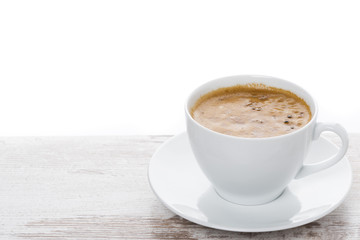 cup of espresso on a white table and space for text