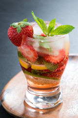 refreshing cocktail with strawberry and citrus, vertical
