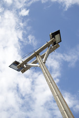 Light poles in the park , spotlights post on blue sky