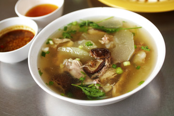 close up chinese chicken soup and vegetable soup in white bowl