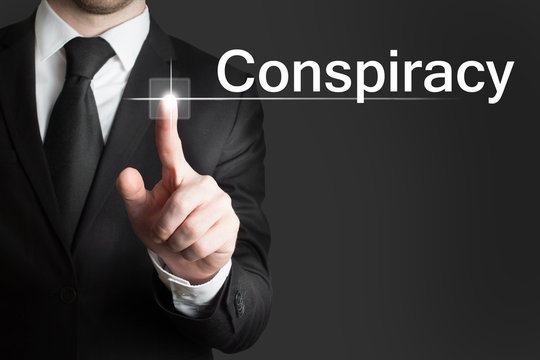 businessman touchscreen conspiracy