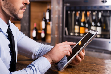 Surfing web in bar.