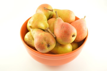 Pears in a bowl isolated on a white background.