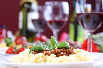 pasta bolognese with basil and cheese - 67507878