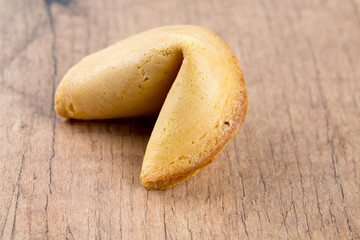 fortune cookie on wooden surface