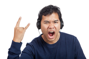 Asian man listen to rock music with headphone
