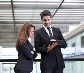 Business people working with electronic tablet at modern office