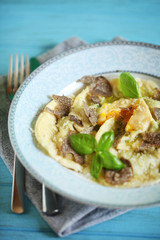 Homemade ravioli stuffed with egg yolk, ricotta and truffles