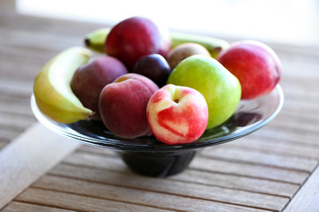 Juicy fruits on wooden table, close-up