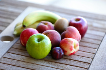 Juicy fruits on wooden table, close-up