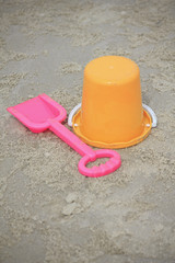 Fototapeta na wymiar bucket, spade child's toys on sand