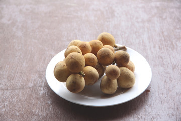 Fresh wollongong fruit in dish.