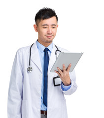 Doctor look at digital tablet