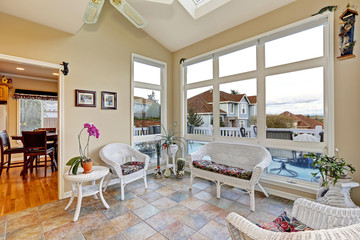 Bright room with white wicker furniture set