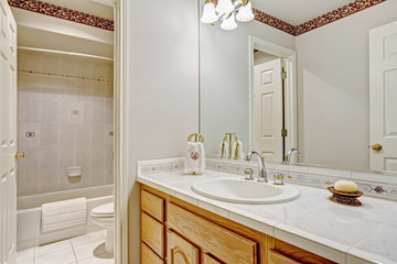Refreshing bathroom interior in white color