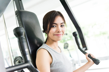 Fototapeta na wymiar Woman workout at fitness