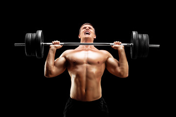 Fototapeta premium Handsome sportsman lifting a heavy weight