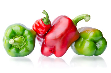 juicy green and red peppers isolated on white background