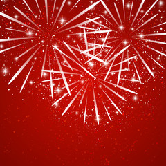 Starry fireworks on red background