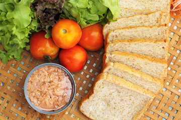 making tuna sandwich with fresh vegetables