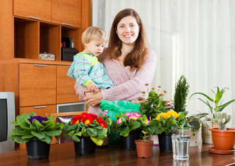 Mother and baby with flowering plants